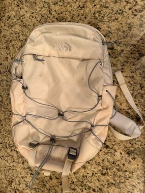 Cream colored the north face borealis backpack